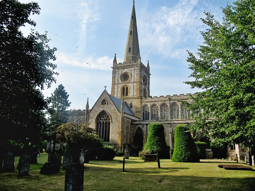 The spire of Holy Trinity Church reflected in the Avon at Stratford