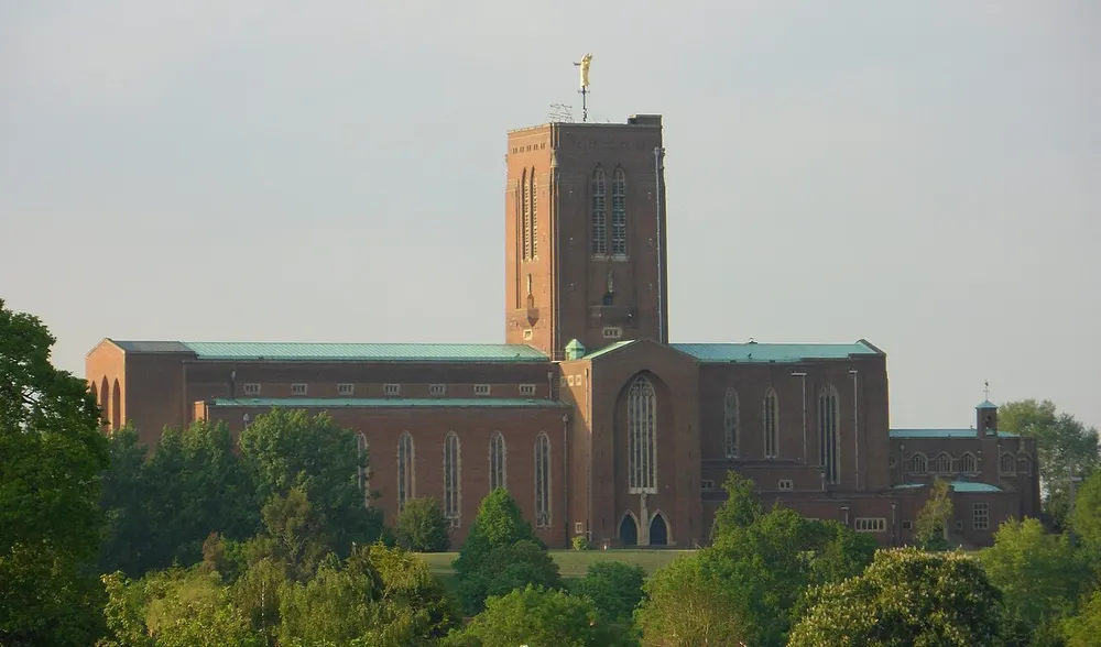 The brick tower of Guildford Cathedral standing on Stag Hill above the town