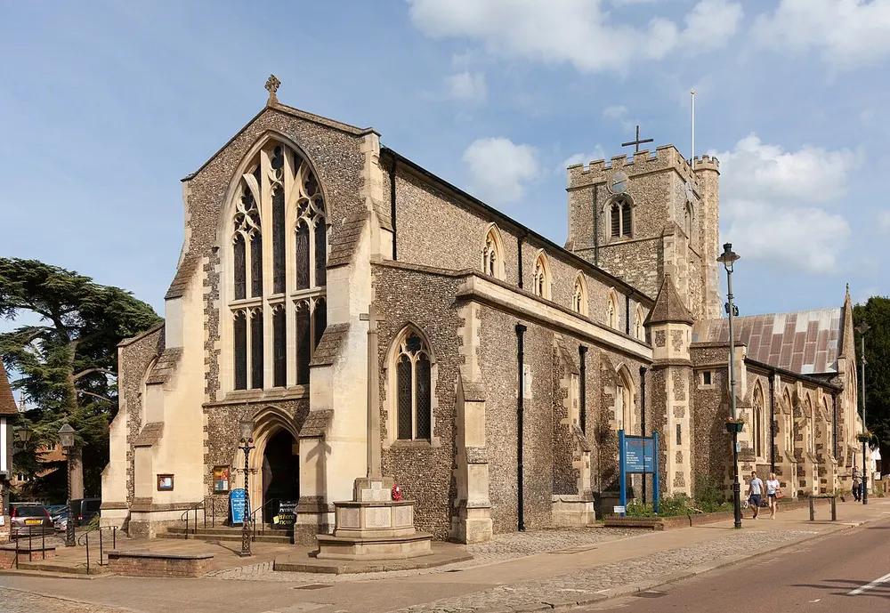 The flint tower of St Peter's Church rising over Berkhamsted High Street