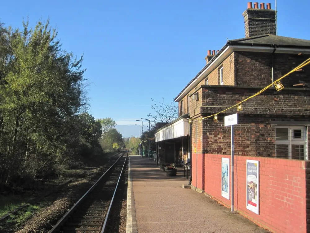 The level crossing and platform at Melton station near Woodbridge