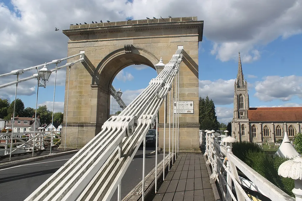 The white towers and chains of Marlow suspension bridge over the Thames