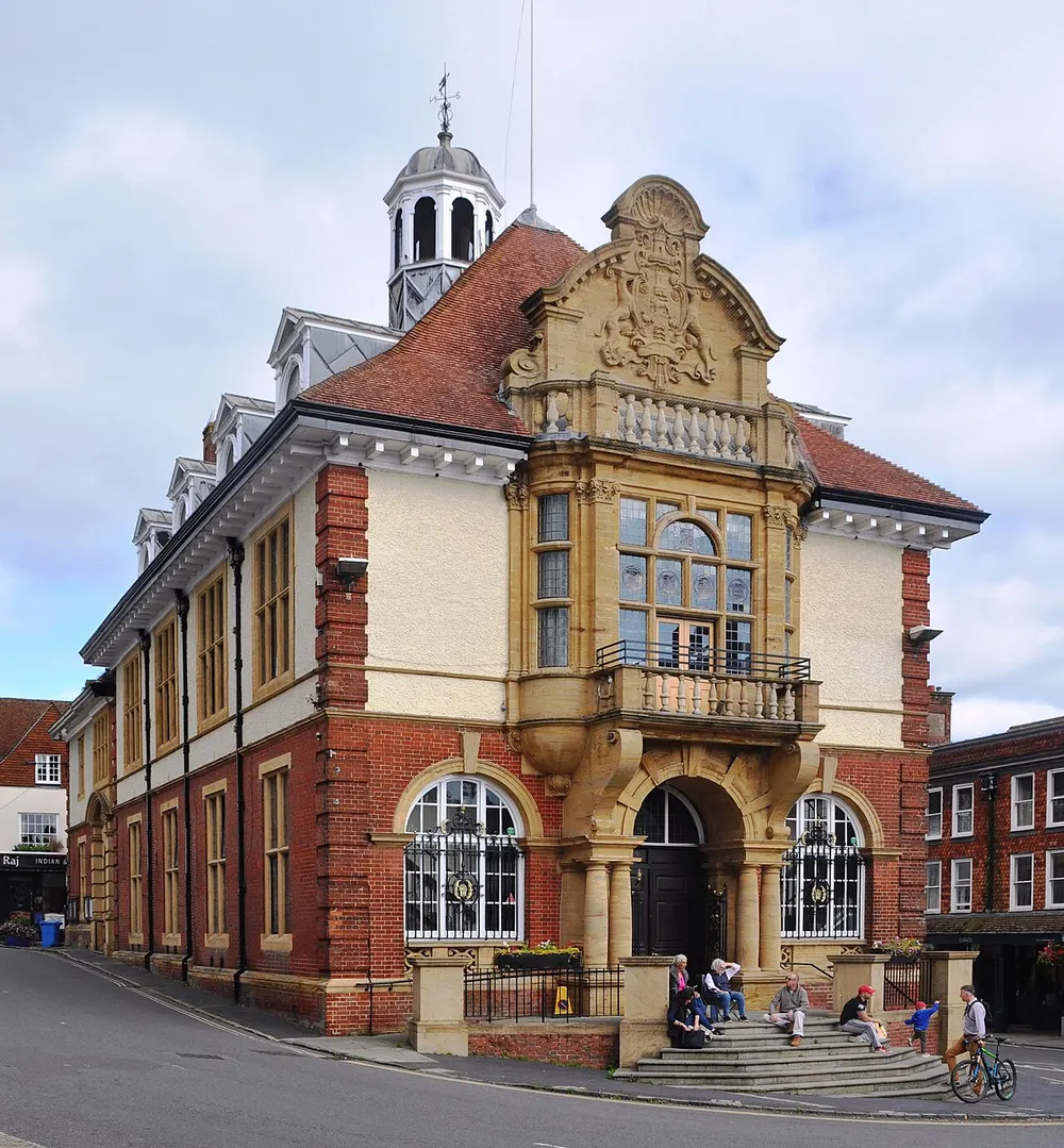 The red brick and stone Town Hall with its cupola closing the view up Marlborough High Street
