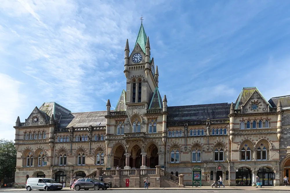 The Gothic stone front of Winchester Guildhall on the Broadway
